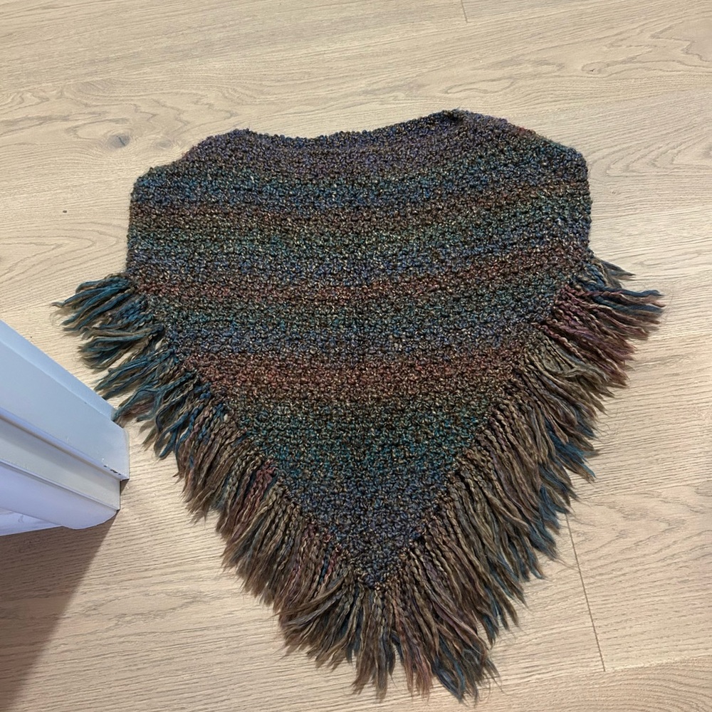 Multicolor Textured poncho with fringe. This is handmade and one size fits all.